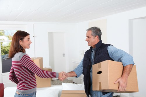 Team unloading moving van at a Hammersmith residence