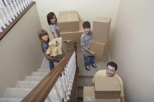 Professional movers assisting with loading in New Eltham